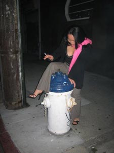 me attempting to mount a fire hydrant in front of the Rite Spot (photo by Ineke)